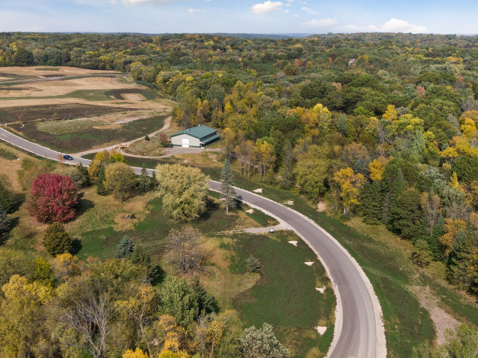 Aerial view of the Heritage build site in Afton, autumn light, bluff country above the St. Croix Valley.